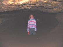 Summer on her knees near end of Lava Cave